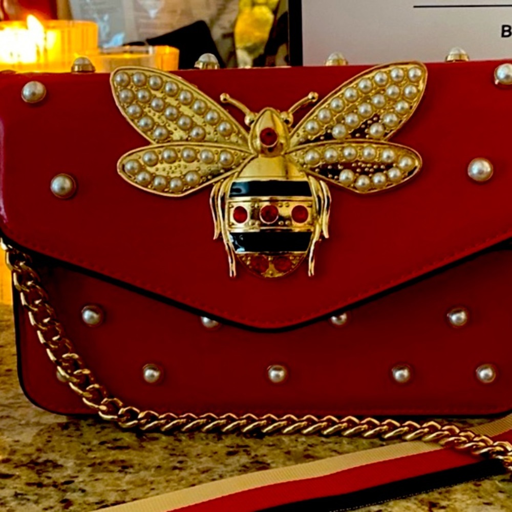 Bee inspired crossbody. Red with white pearls and two straps.